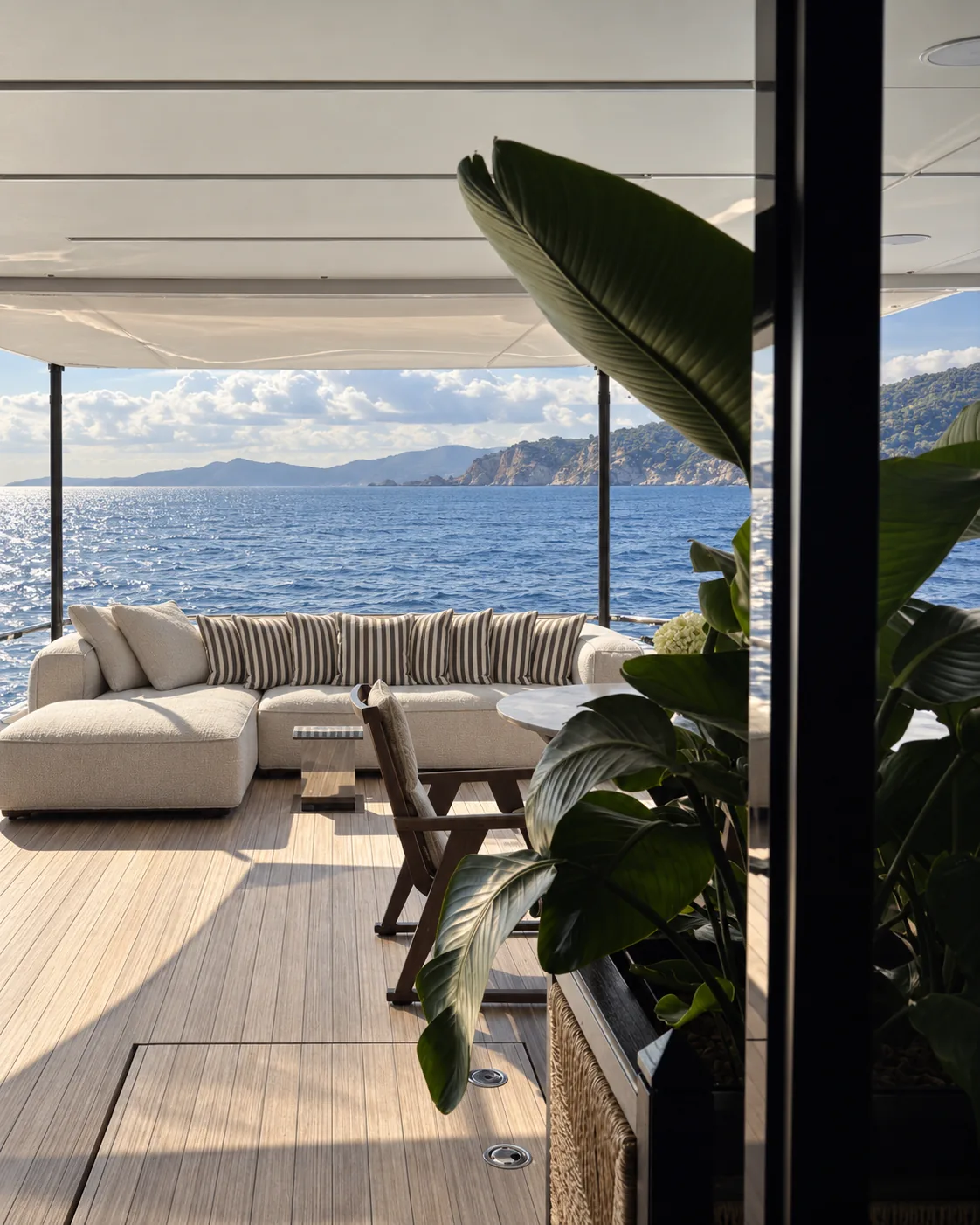 Sheltered aft deck lounge overlooking the sea