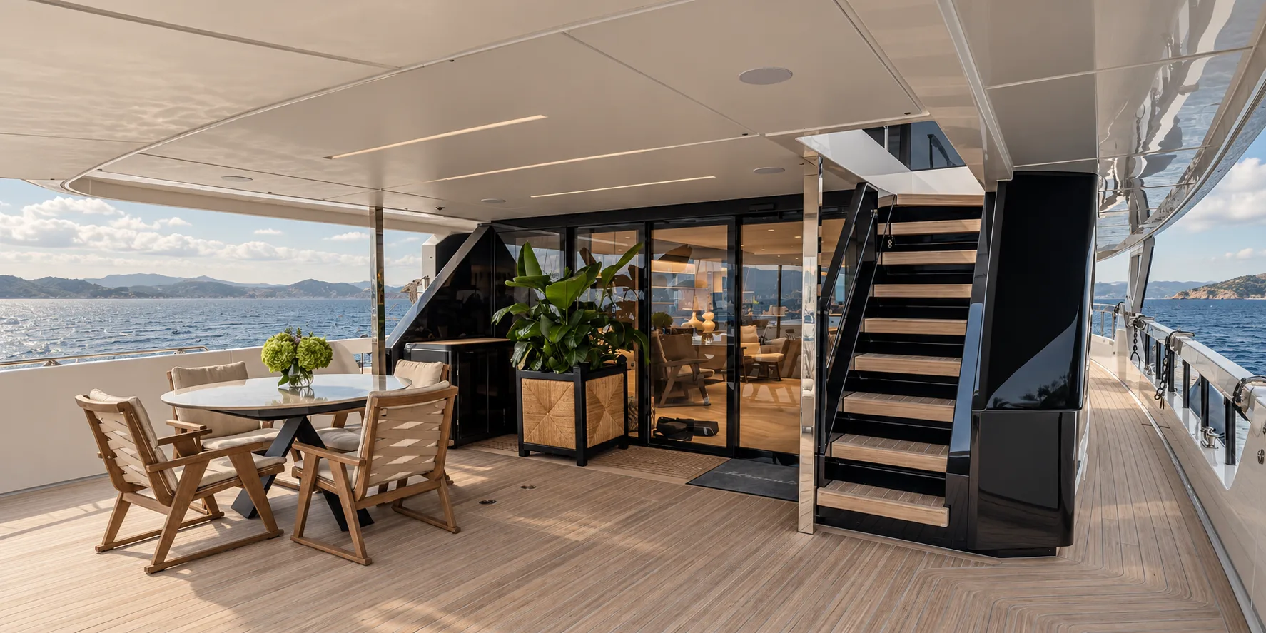 Aft deck dining table under the overhang of the upper deck