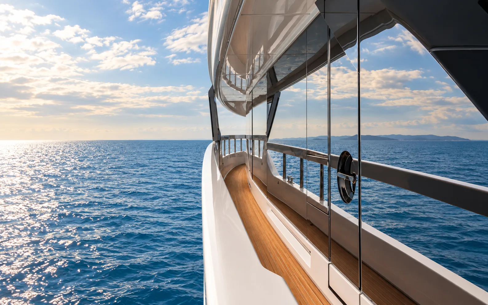 Side deck with the sky reflected in the superstructure glass
