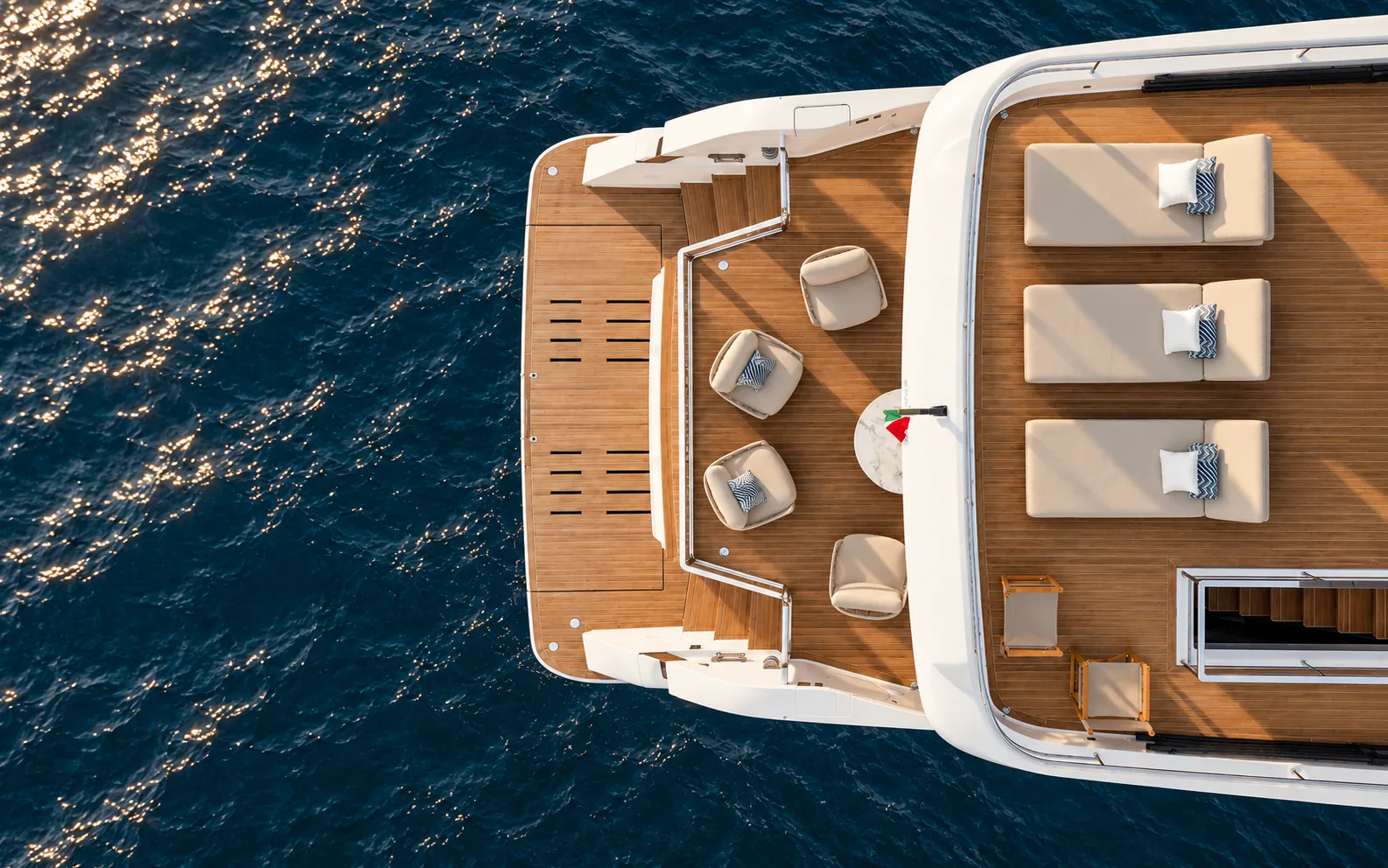 Aerial view of the upper deck sunpads and teak deck