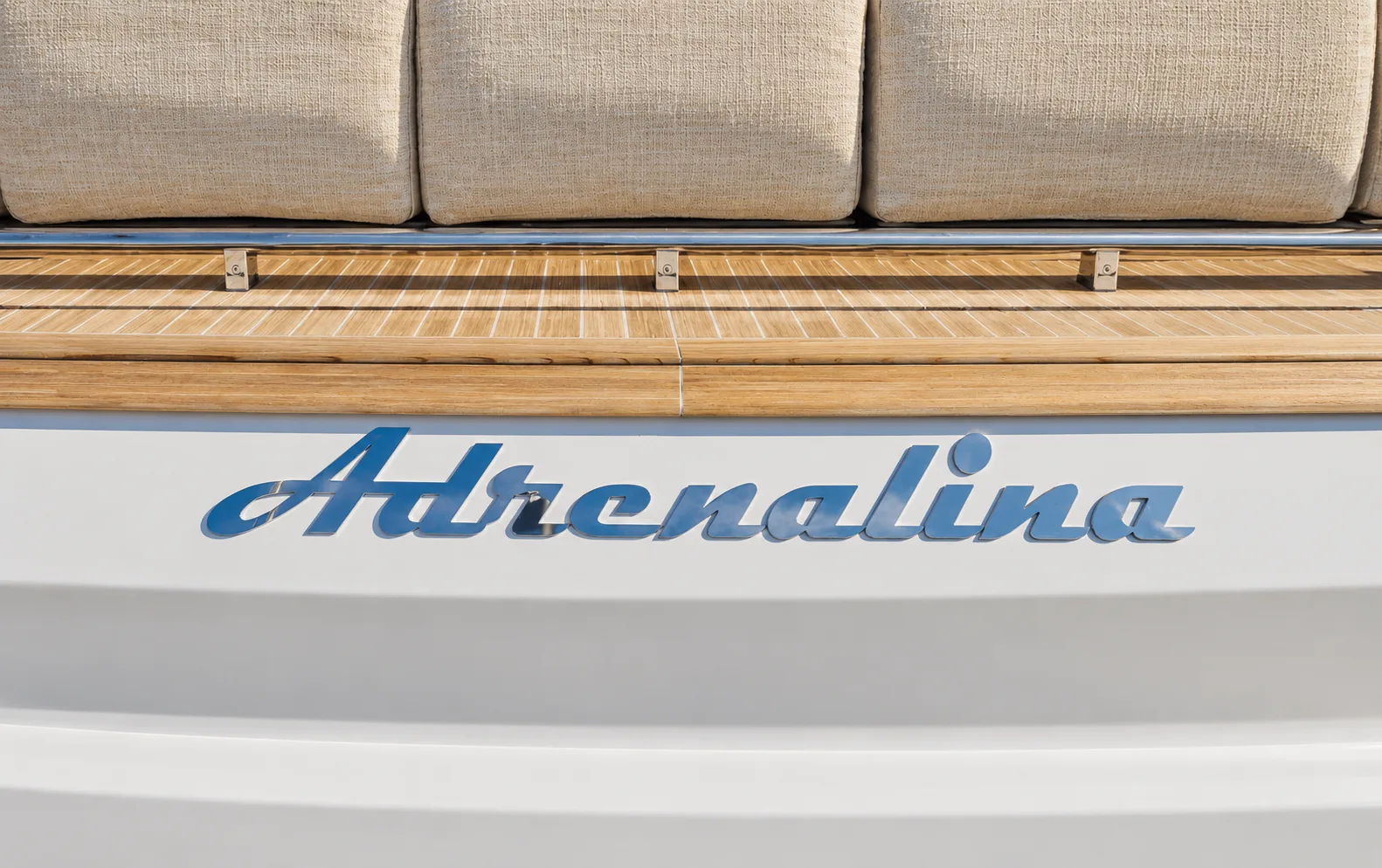 The yacht’s name on the transom below the sunpad