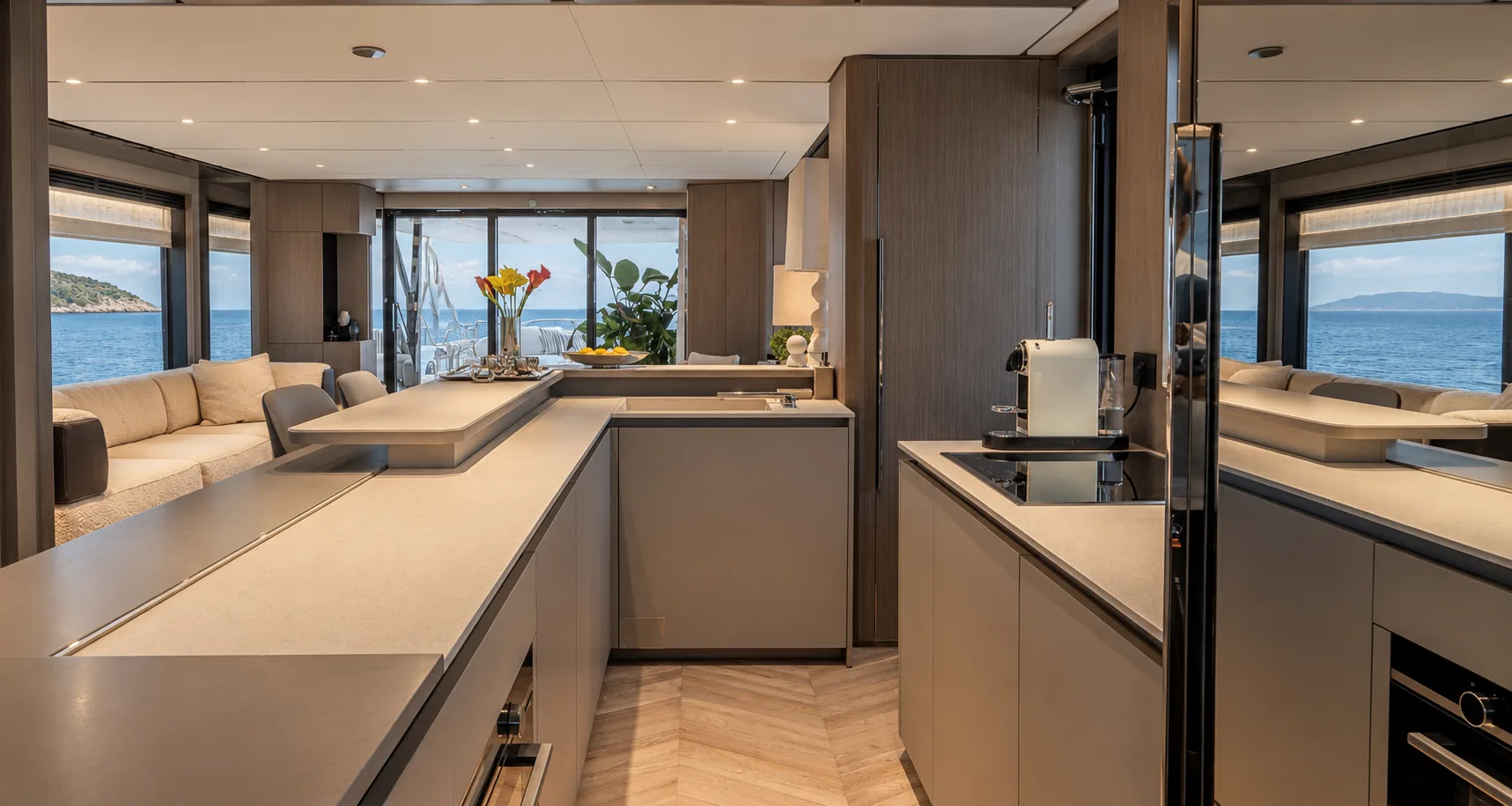 Galley with stone counters and windows to the sea