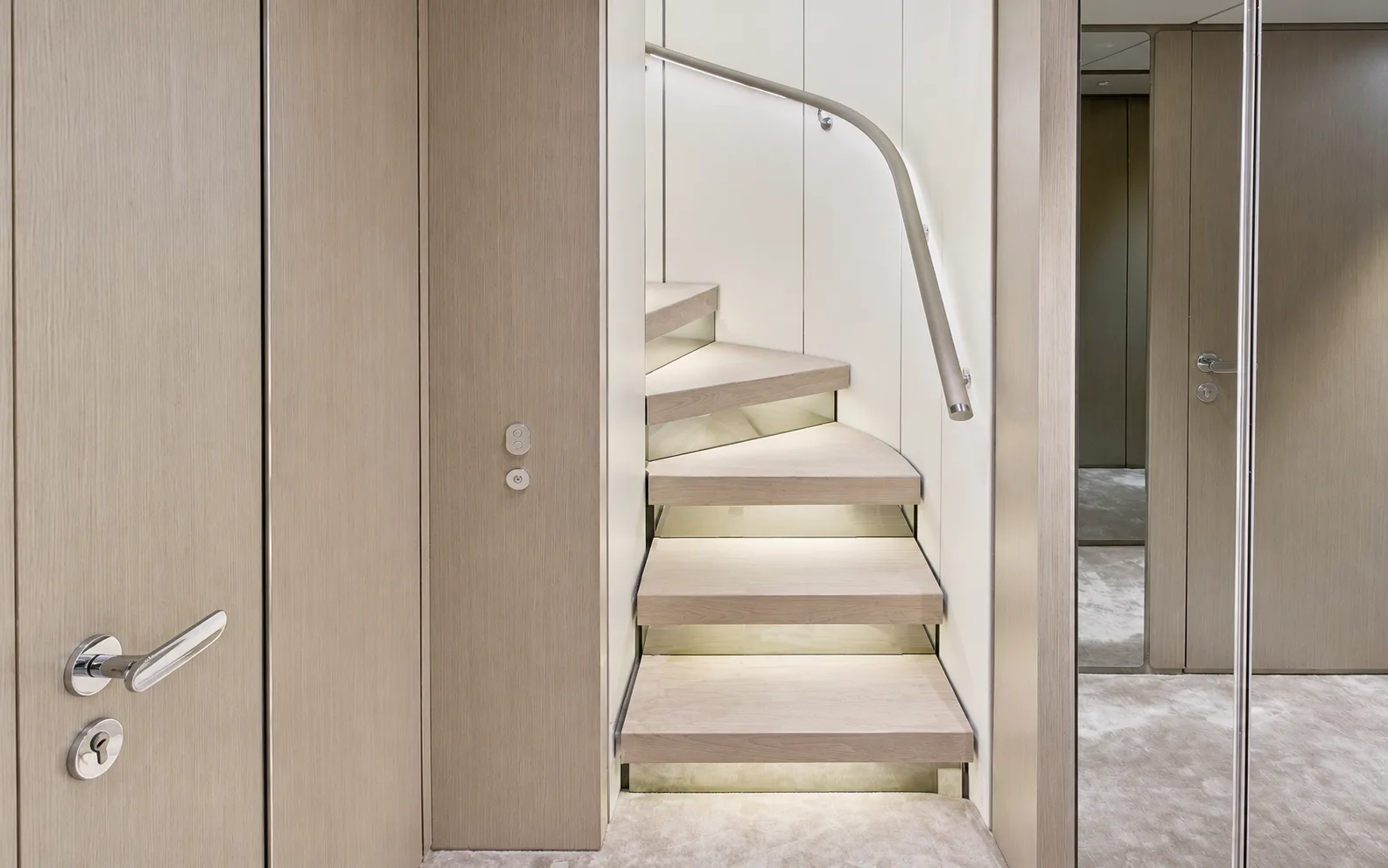 Staircase lobby with lit treads