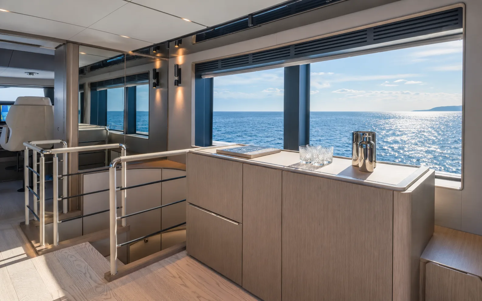 Bar counter in the upper saloon, with windows to the sea
