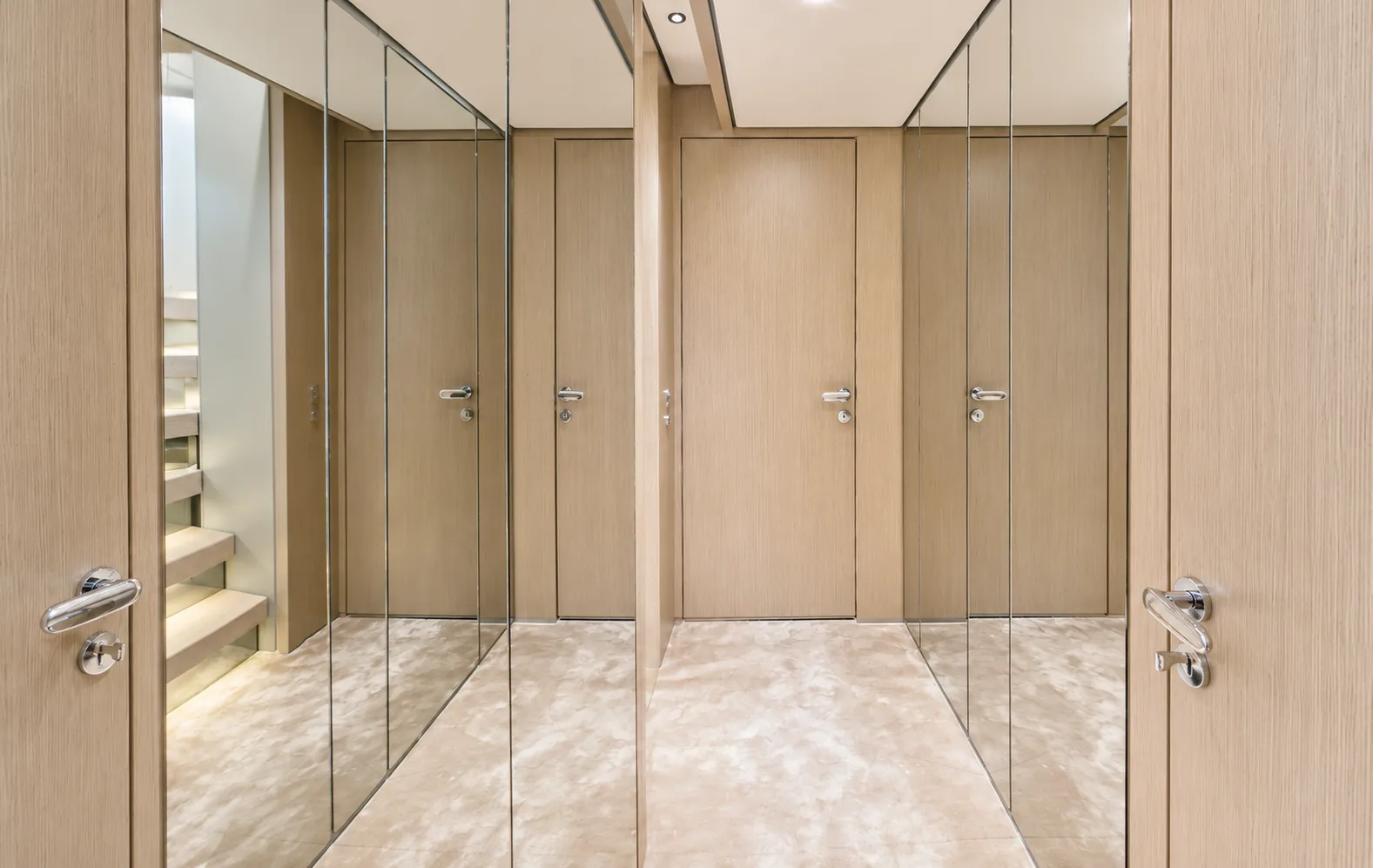 Lower-deck lobby with mirrored wardrobe doors