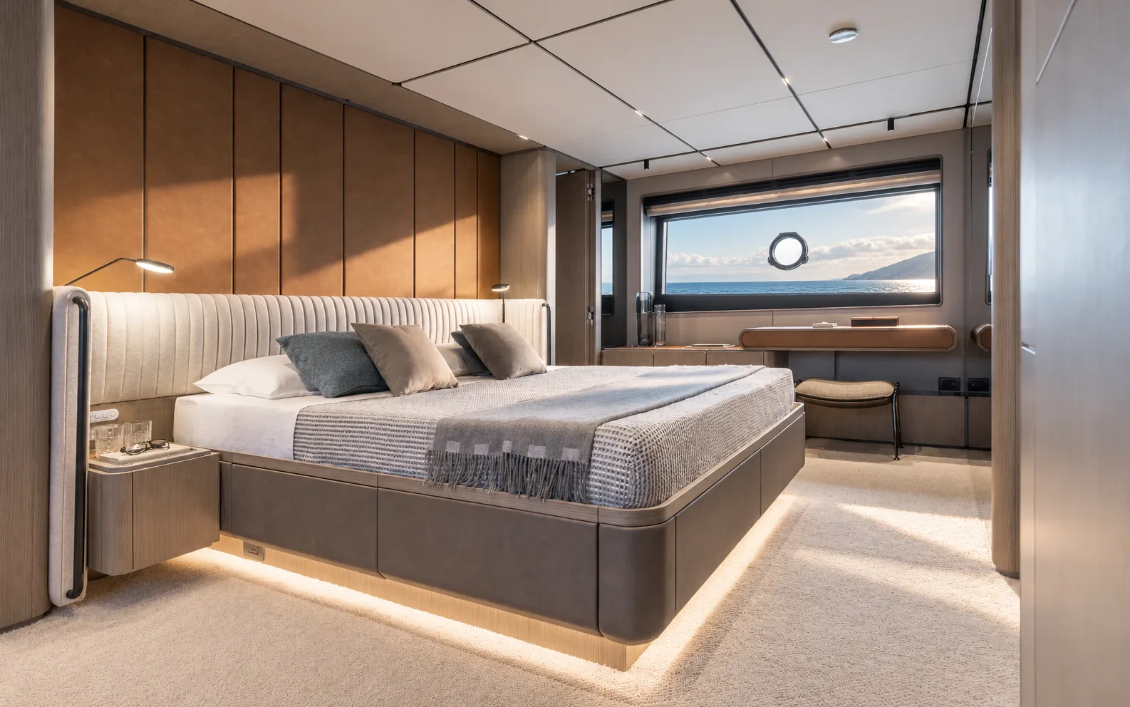 Owner’s suite, the bed facing forward under a hull window