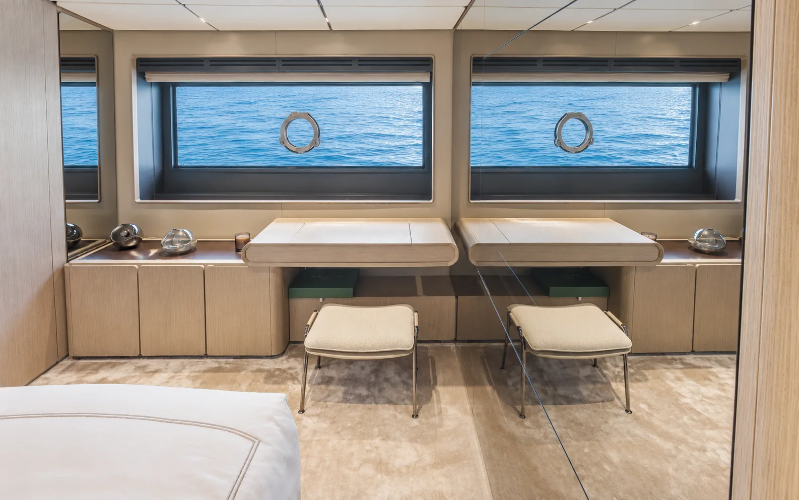 Desks beneath the hull windows in the owner’s suite