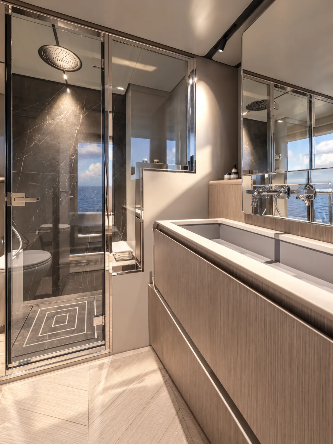Bathroom in dark stone with a glass shower