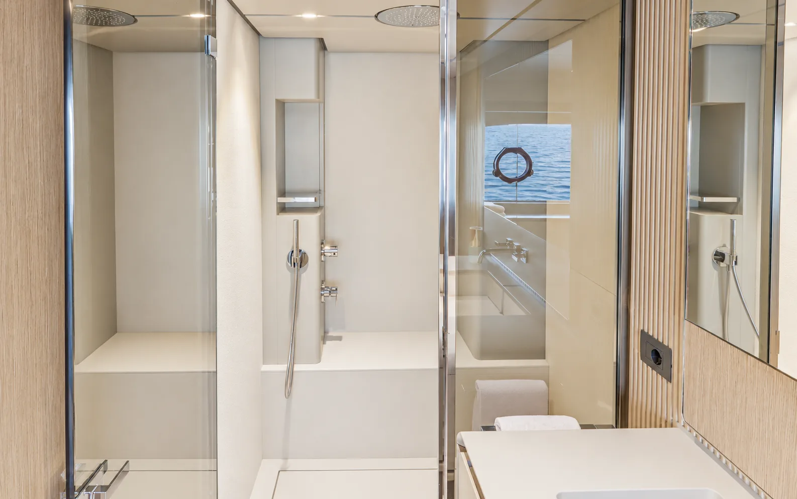 Glass shower beside a hull window