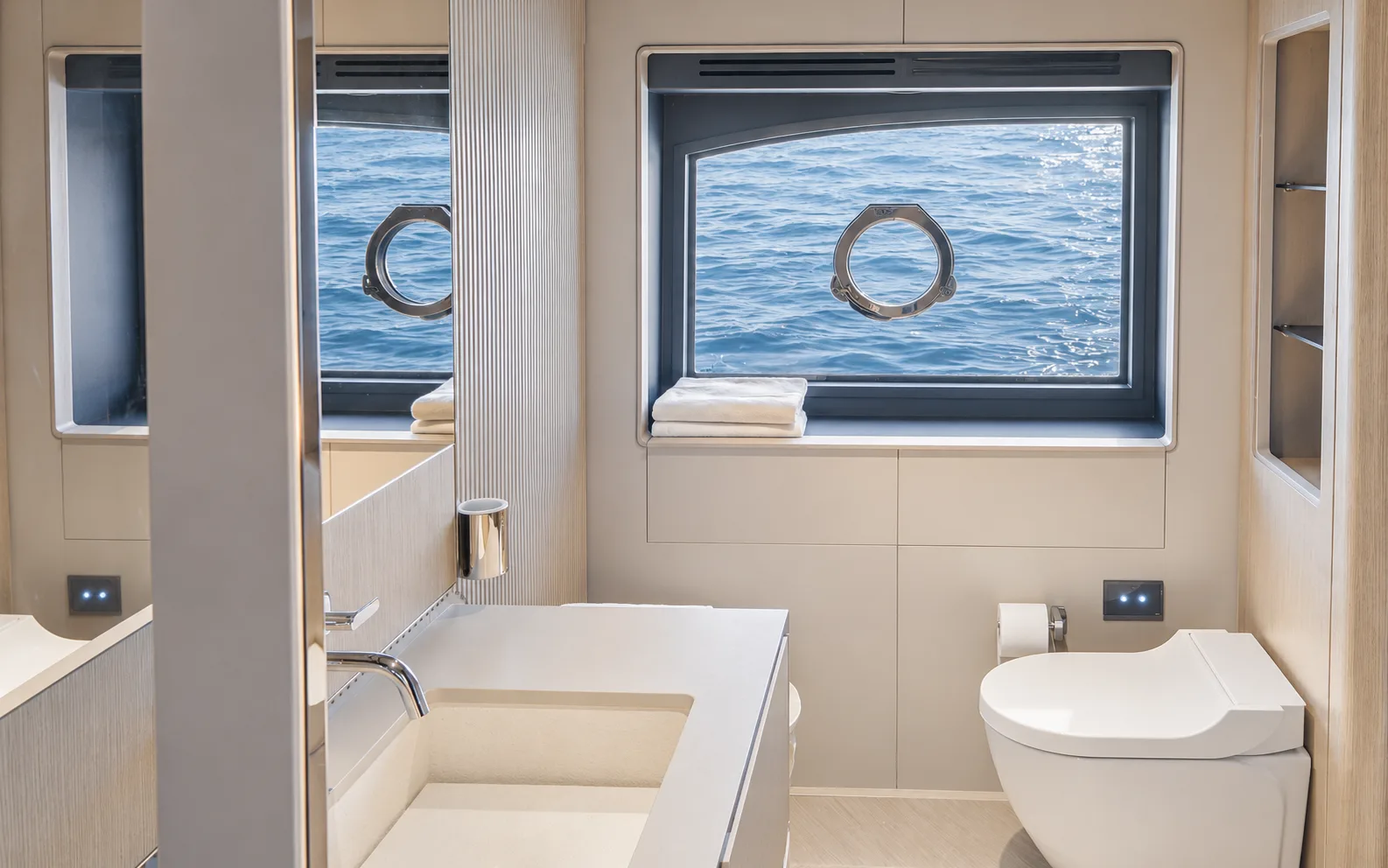 Bathroom with a vanity under a round porthole