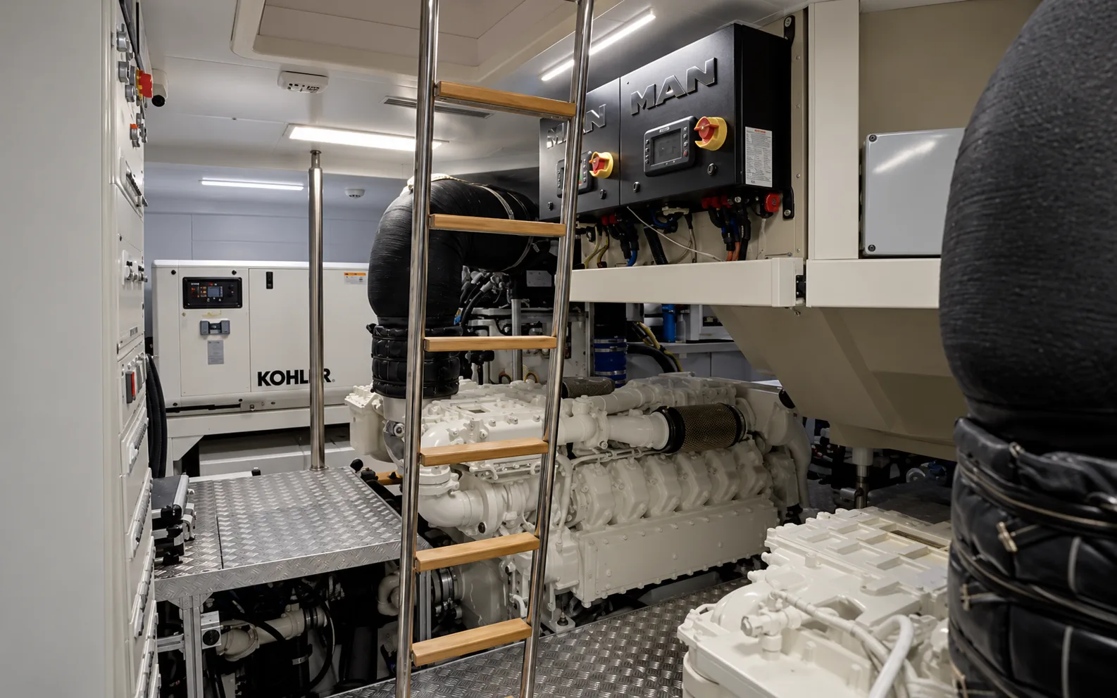Engine room with the access ladder and the MAN engines